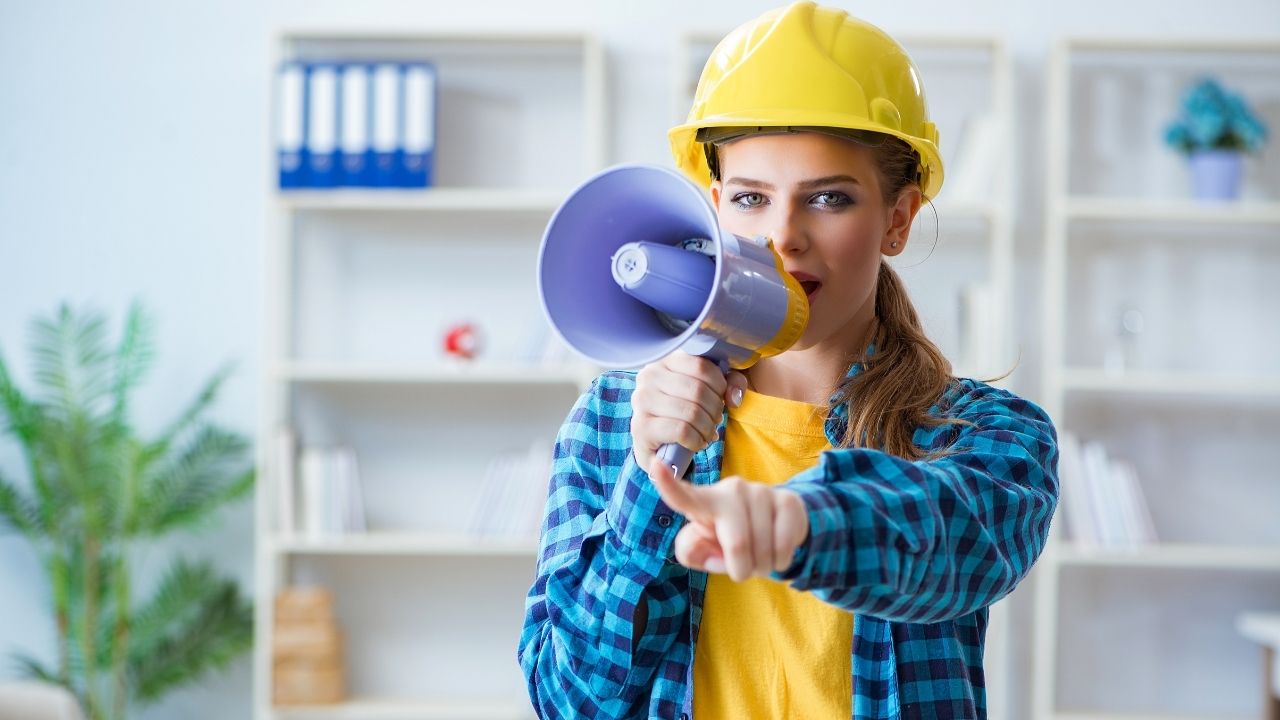 woman worker using megaphone